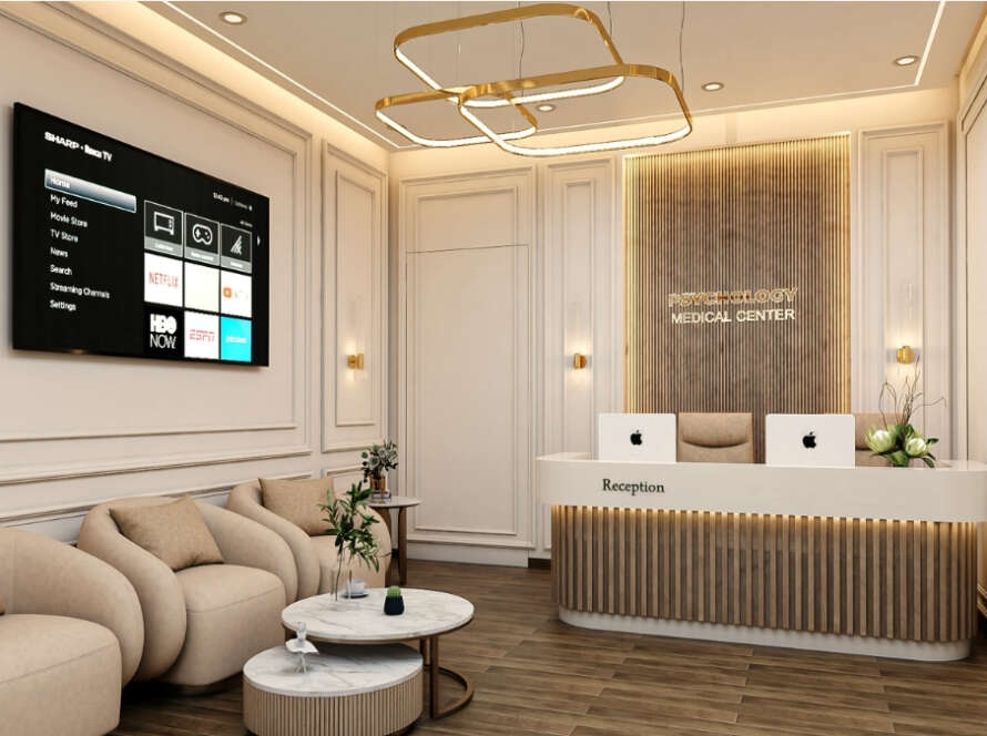 Close and side angle of reception counter with soft lighting at Psychology Medical Centre Dubai